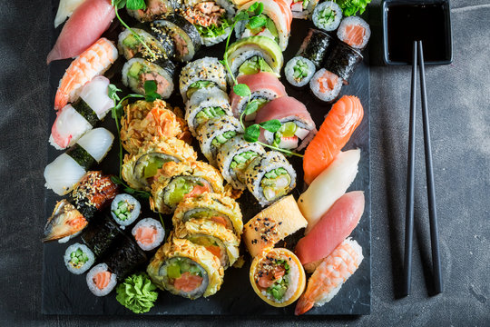Big mix of sushi made of fresh vegetables and seafood