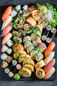 Big sushi set made of fresh vegetables and seafood
