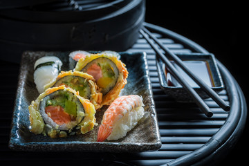 Enjoy your sushi mix with wasabi and soy sauce
