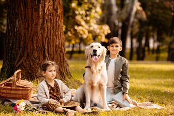 children and dog in park