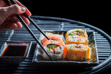 Delicious sushi set made of fresh vegetables and seafood