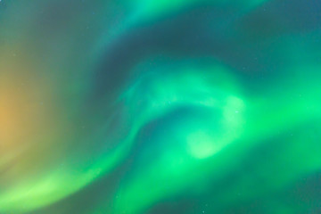 Obraz na płótnie Canvas Beautiful picture of massive multicolored green vibrant Aurora Borealis, Aurora Polaris, also know as Northern Lights in the night sky over Norway, Scandinavia
