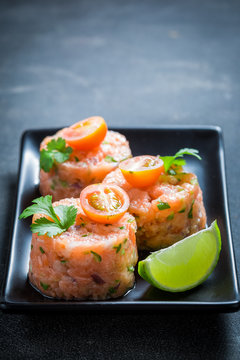 Fresh salmon tartare with lime and cherry tomatoes