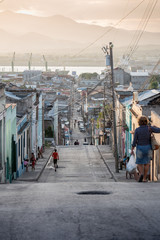 Daily life street setting at sun down in Trinidad, Cuba