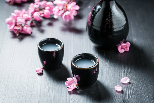 Prepared to drink sake with flowers of blooming cherry