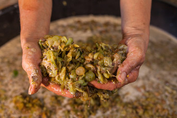 Farmer hands keep grape must