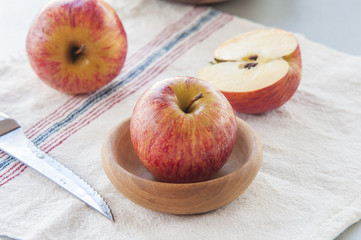 Ripe red apples on table close up
