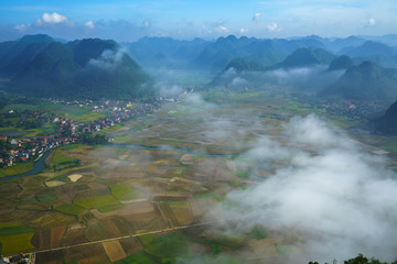 Aerial view of multiple mountain peaks and rice field Bac Son, Vietnam