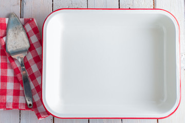 Clean white enameled form for oven, top view, copy space