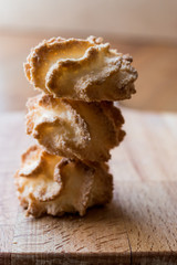 Coconut Cookies on wooden surface.