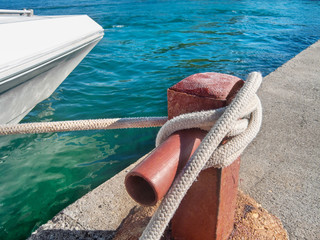 Fototapeta premium blue ocean and a yacht at the pier
