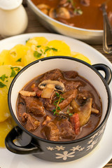 Beef stew goulash with bacon and mushrooms