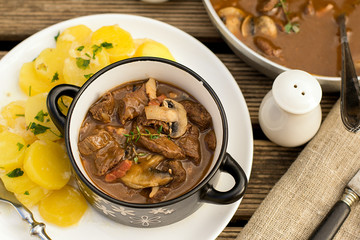Beef stew goulash with bacon and mushrooms