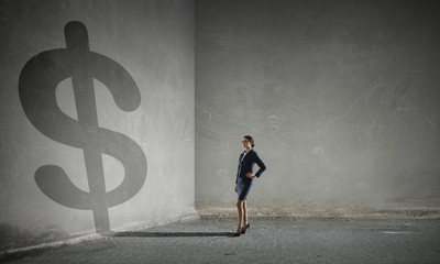 Businesswoman in empty room . Mixed media