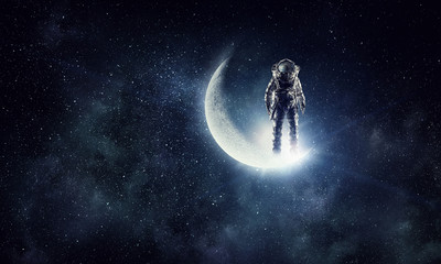 Obraz na płótnie Canvas Astronaut explorer in sky. Mixed media