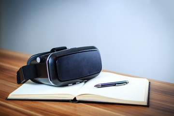 VR glasses lying on a notebook