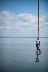 Hook hanging near the calm seaside. The Curonian Spit, Lithuania.