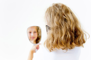 Girl dries and styles her hair