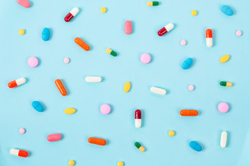 Colorful pill tablets background.