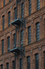 brick buildings with outside fire escape stairs
