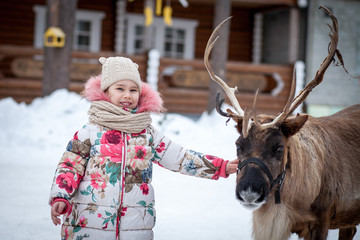 girl reindeer winter © fotiev