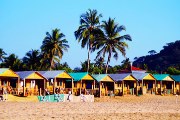 Cozy private resort (bungalows) on the beach, Agonda beach, South Goa. Colorful beach huts.