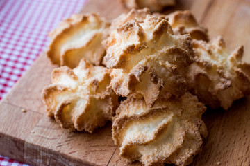 Coconut Cookies on wooden surface.