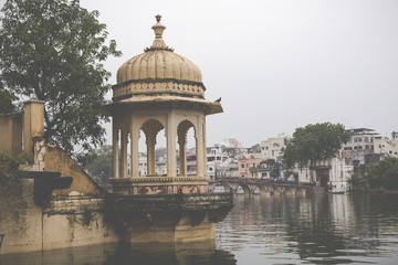 Fototapeta na wymiar Lake Pichola with City Palace view in Udaipur, Rajasthan, India