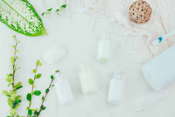 Fototapeta na wymiar Bathroom accessories. Shower gel, body lotion, shampoo on fabric background for the bath.