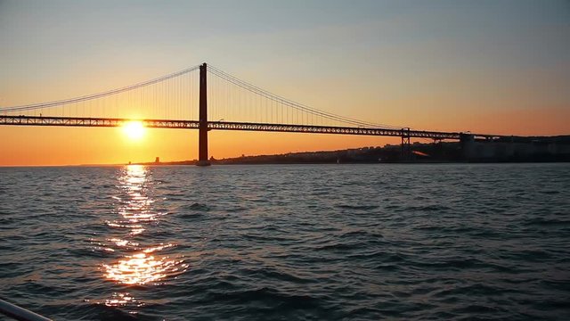Amazing Sunset Behind Famous Bridge In Tagus River. Lisbon is the capital and the largest city of Portugal
