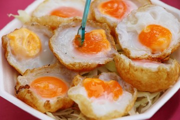 Quail eggs with sauce in street food