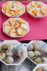 Quail eggs with sauce in street food