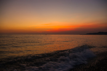Fototapeta premium Amazing sea sunset, the sun, waves, clouds