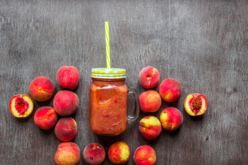 Glass of peach fresh on wooden table