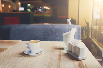Modern restaurant interior, coffee cup on table
