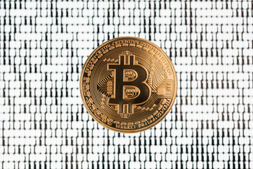 Bitcoin on white binary code blurred background