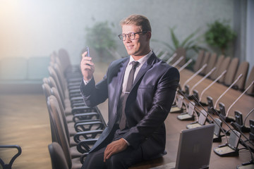 joyful businessman in conference room