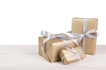 Christmas holiday gift boxes wrapped in paper on white