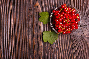 fresh red currant and jam on the rustic background