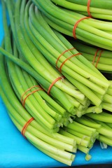 Onion flower stem for cooking in market