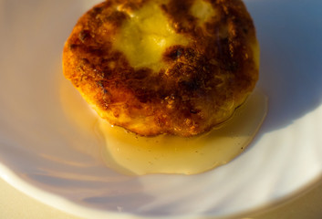 fried cheesecake drizzled with fresh honey