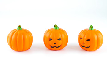 Rubber toy pumpkin for halloween decoration isolated on white background