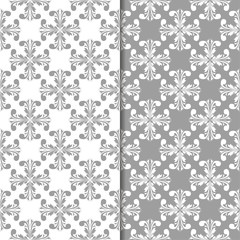 Naklejka na ściany i meble White and gray set of floral seamless patterns