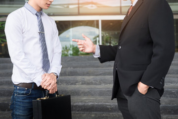 Two confident business partners discussing workflow plan talking and working together