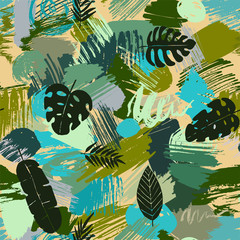 Seamless pattern with tropical leaves on abstract watercolor stains