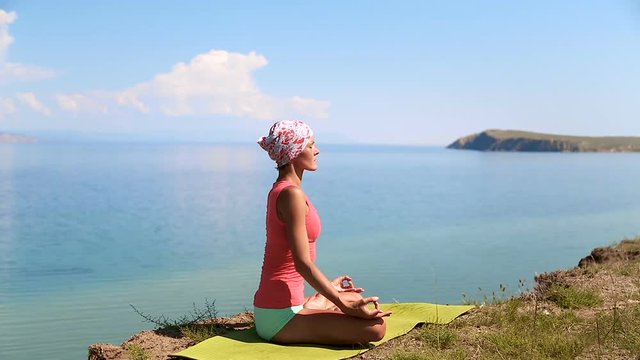 Young Woman sitting in Yoga Pose. Healthy Active Lifestyle.