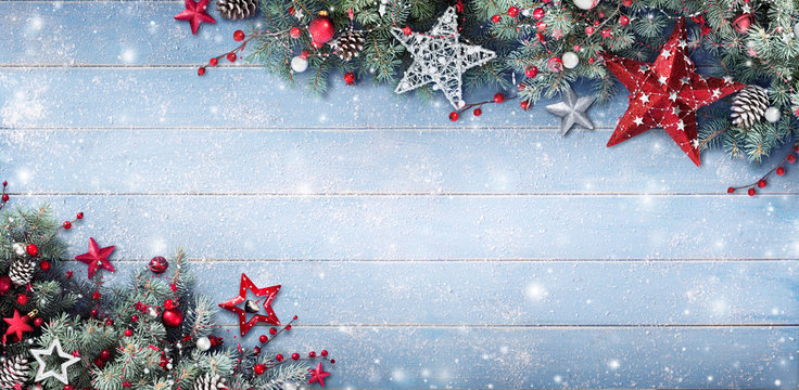 Christmas Background - Fir Branches And Baubles On Snowy Plank
