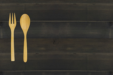 wooden spoon and fork on wooden table