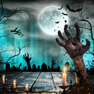 Scary Halloween background with zombie hands.