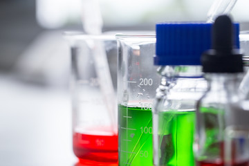 Backgrounds of Science research with glassware for laboratory testing.